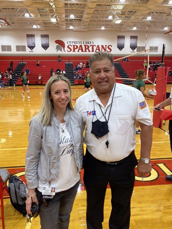 Trustee Gilbert Sarabia officiating a volleyball game at Cypress Lakes High School