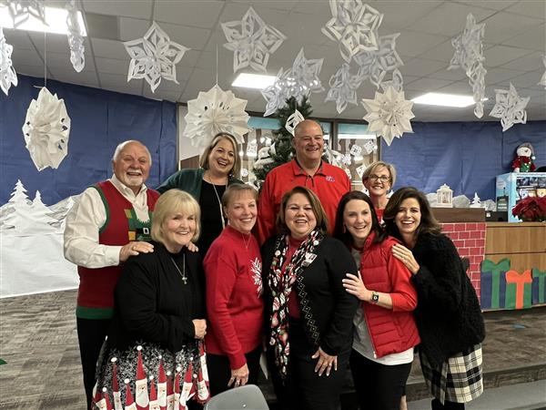 Trustee Julie Hinaman attending the staff holiday party at Lamkin Elementary